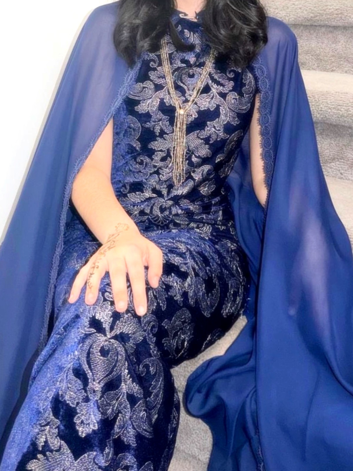 Navy velvet devoré gown with silver embroidery and a chiffon cape