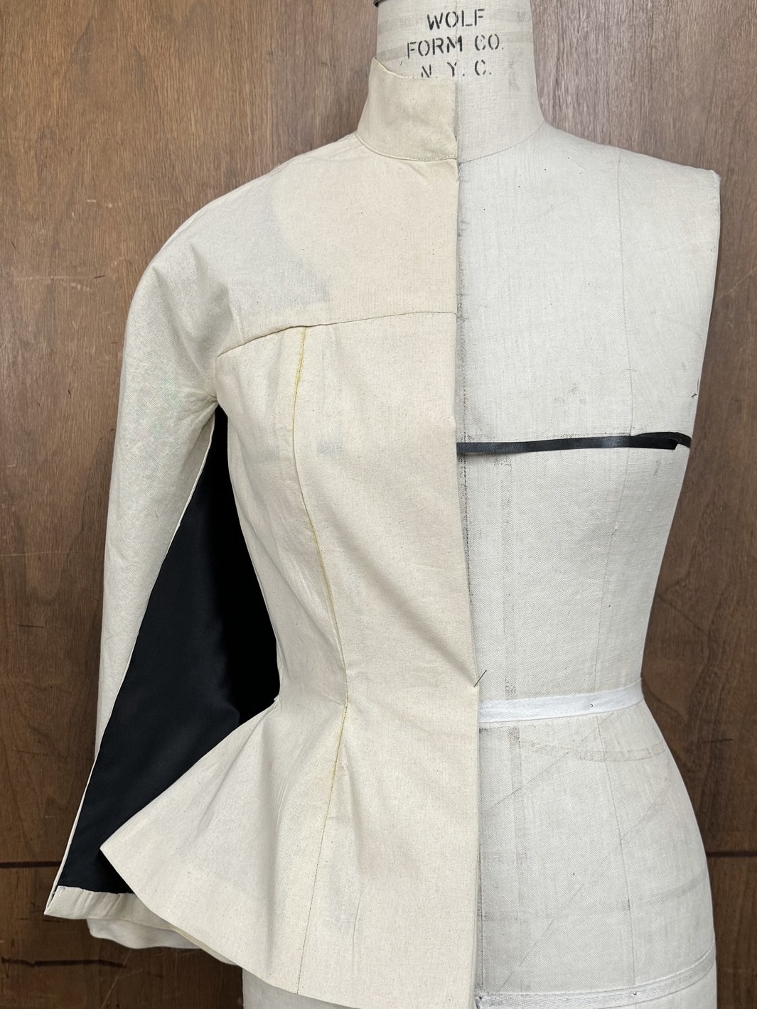 Toile of the tailoring-cape pinned on a tailor's stand in the atelier